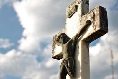 Low angle view of statue against sky