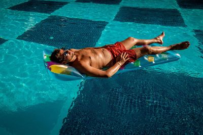 High angle view of man swimming in pool