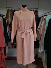 Midsection of woman standing against wall