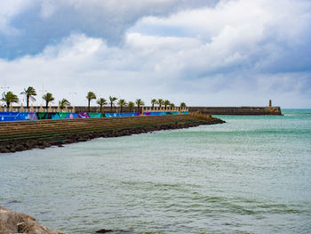 Scenic view of beach against sky