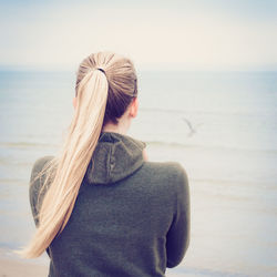 Rear view of woman looking at sea