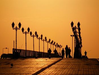 Silhouette of statue against sky during sunset