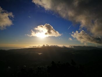 Scenic view of silhouette mountains against sky