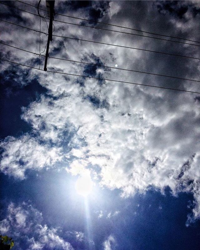 LOW ANGLE VIEW OF ELECTRICITY PYLON AGAINST CLOUDY SKY