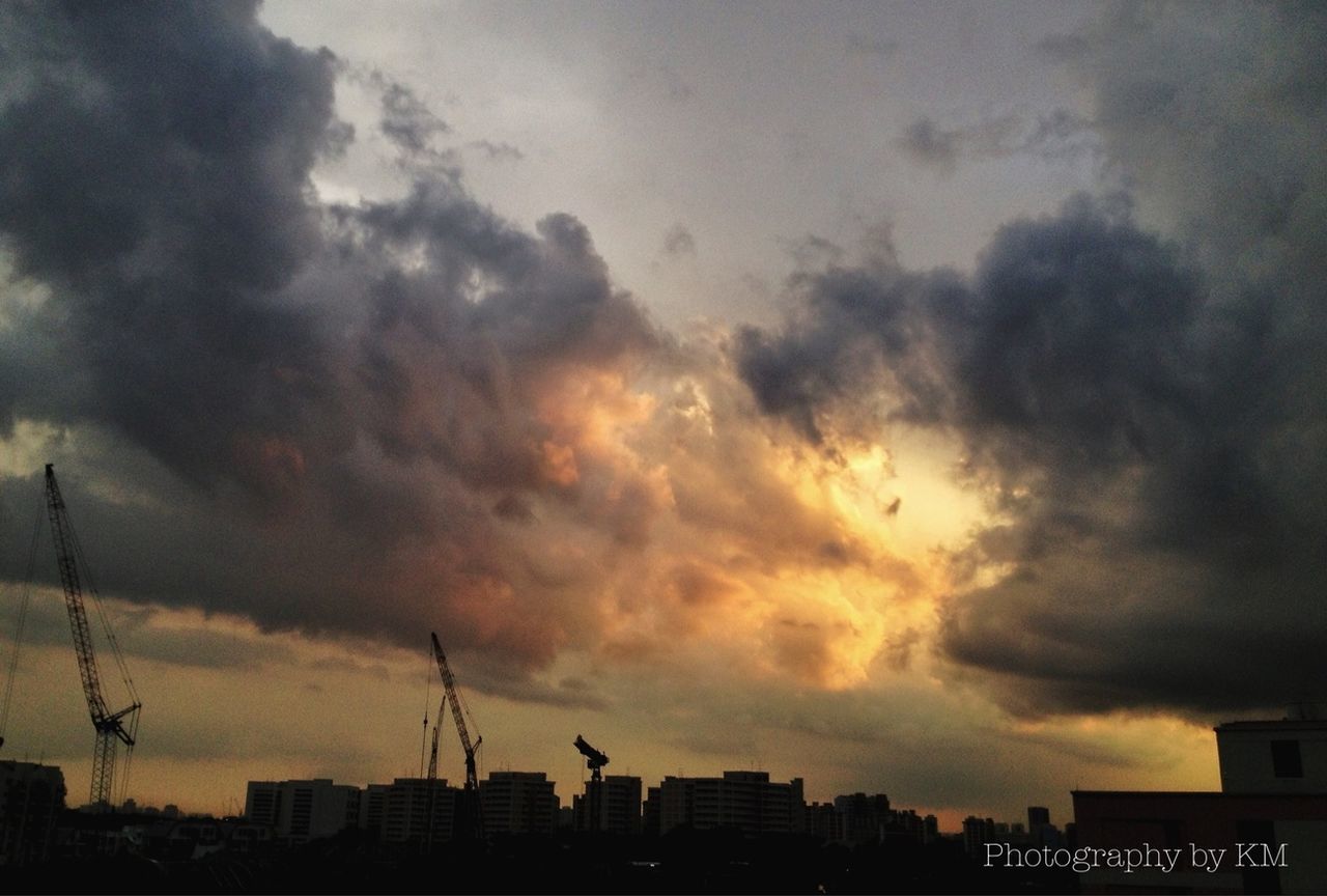 building exterior, architecture, sky, built structure, cloud - sky, cloudy, city, weather, sunset, overcast, silhouette, cityscape, dusk, cloud, storm cloud, building, residential building, low angle view, outdoors, tower