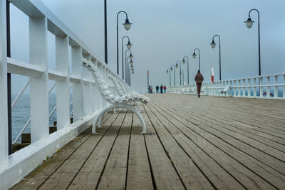 View of people on footpath by bridge