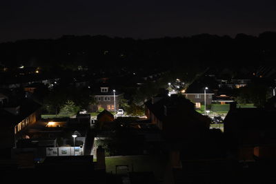 Illuminated buildings against the sky