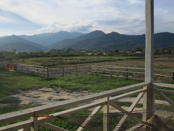 Scenic view of landscape and mountains against sky