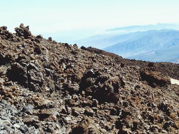 Rock formations on landscape against sky