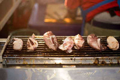 High angle view of meat on barbecue grill