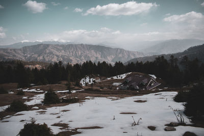 Scenic view of snowcapped mountains against sky