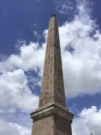 Low angle view of monument against cloudy sky
