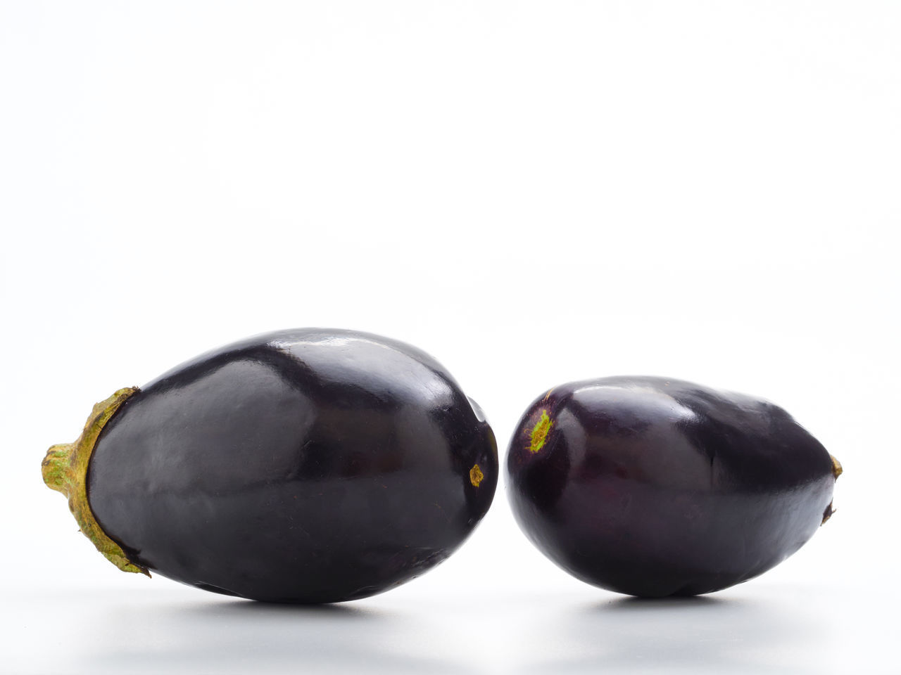 CLOSE-UP OF FRUITS ON WHITE BACKGROUND