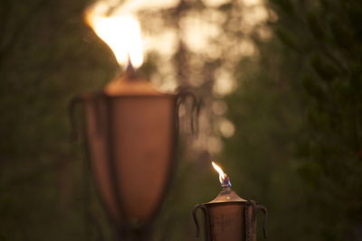 Close-up of illuminated candle against blurred background