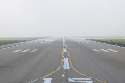 View of airport runway against clear sky