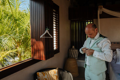 Man standing by window