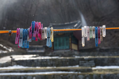 Colorful clothespins on clothesline against geonbongsa