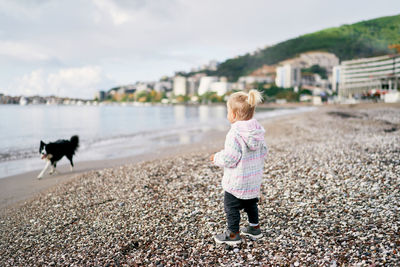 Full length of girl walking on beach