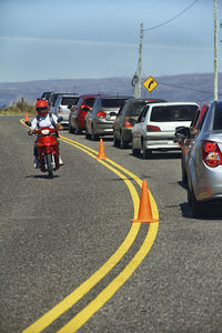 Cars on road against sky