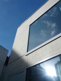 Low angle view of building against blue sky