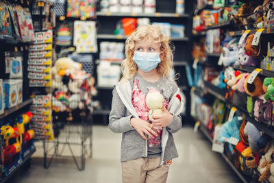 Girl holding ice cream at store