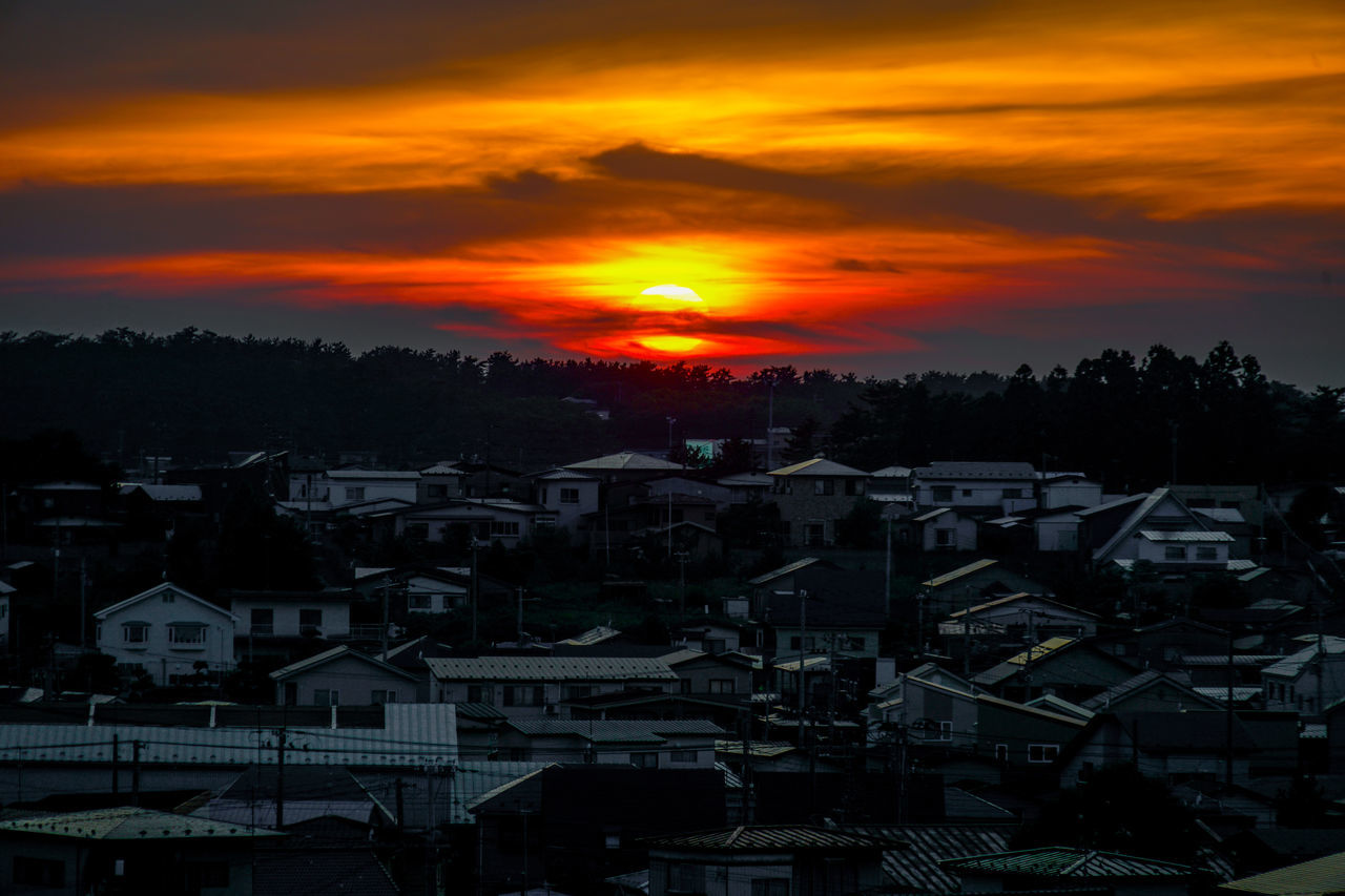 sky, architecture, sunset, cloud, building exterior, built structure, building, city, nature, residential district, house, dusk, cityscape, afterglow, orange color, sun, landscape, no people, evening, environment, horizon, beauty in nature, scenics - nature, dramatic sky, sunlight, high angle view, outdoors, silhouette, travel destinations, town, tree