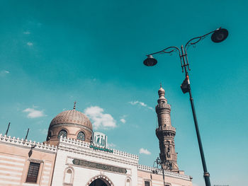 Low angle view of built structure against blue sky