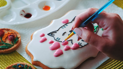 Close-up of hand painting on table