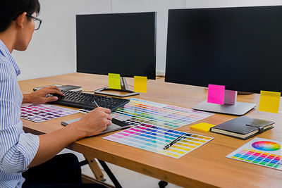 Man using laptop on table