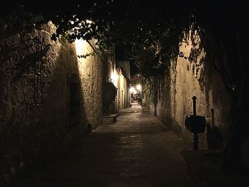 Walkway along buildings at night