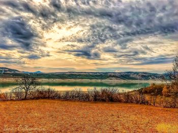 Scenic view of landscape against sky during sunset