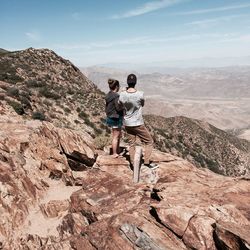 Rear view of man standing on mountain