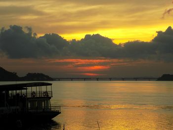 Scenic view of sea against orange sky