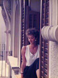 Woman sitting at window sill