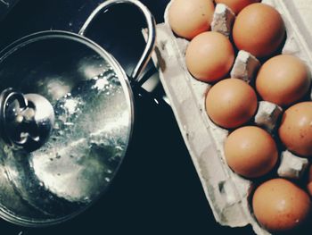 High angle view of eggs in container on table