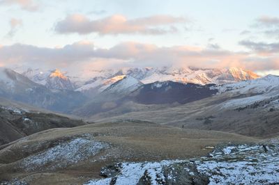 Scenic view of mountains against sky during winter