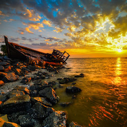 Scenic view of sea at sunset