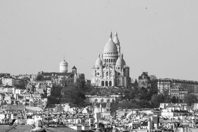 Panoramic view of buildings in city against clear sky