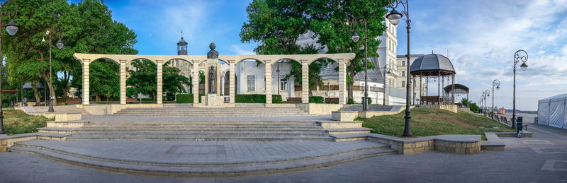 Gazebo in park against buildings in city