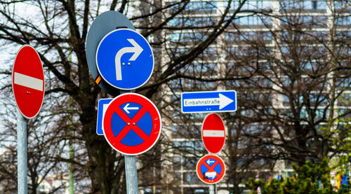 Low angle view of road sign against sky