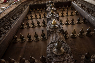 Low angle view of buddha statue against building