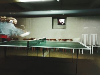 Blurred motion of woman playing table tennis