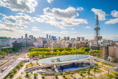 High angle view of buildings against cloudy sky