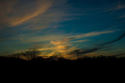 Scenic view of silhouette landscape against sky during sunset