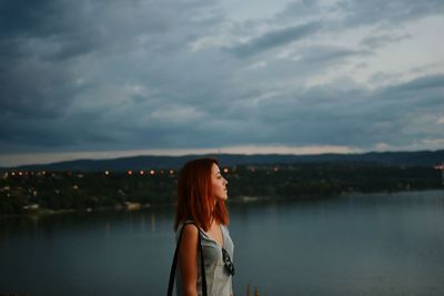 Rear view of woman standing in water