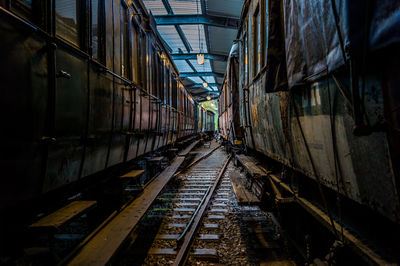 Railroad tracks amidst buildings