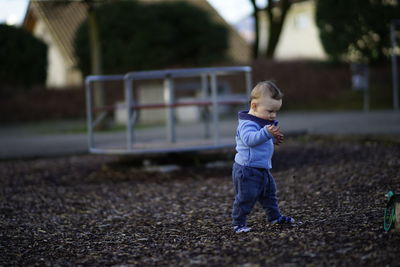 Cute boy walking in playground
