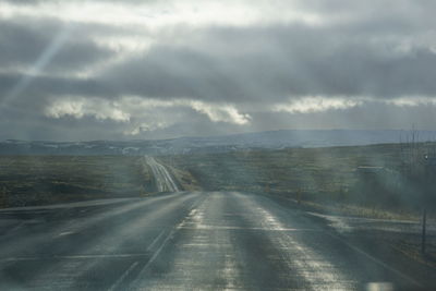 Road against cloudy sky