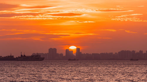 Silhouette of city at sunset