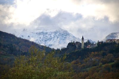 Scenic view of snowcapped mountains against sky